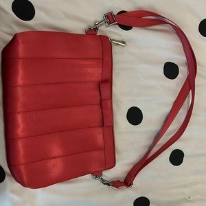 Harvey’s pink clutch with bow - made of seat belts